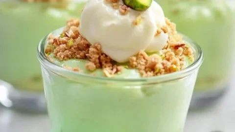 Delicious pistachio pudding parfaits served in elegant glasses for Easter dessert.