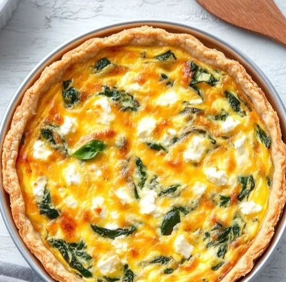 Delicious spinach feta quiche with a flaky crust and fresh spinach