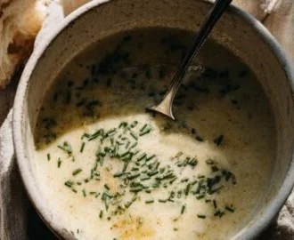 Bowl of creamy roasted potato leek soup by Ina Garten