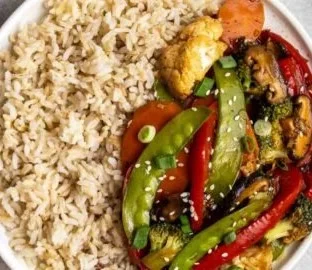 Colorful Thai stir-fry vegetables with fresh ingredients in a wok.