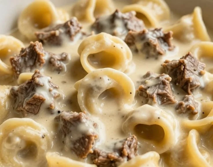 Creamy one-skillet beef stroganoff tortellini served in a bowl.