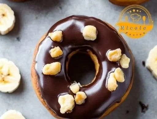 Delicious banana doughnuts with a glossy chocolate glaze on a plate