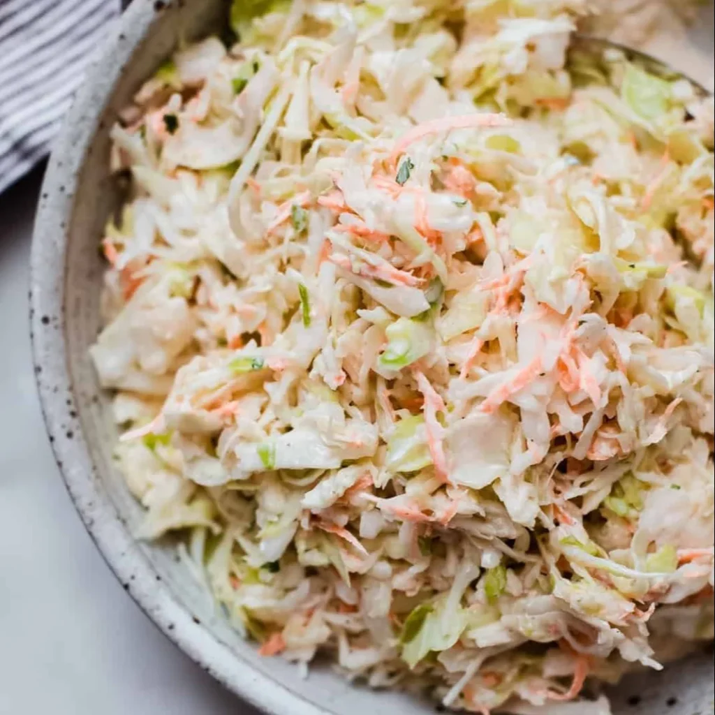 Bowl of summer classic coleslaw with colorful vegetables