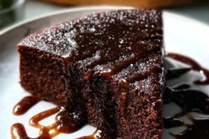 Delicious Dark Chocolate Whiskey Cake topped with chocolate ganache.