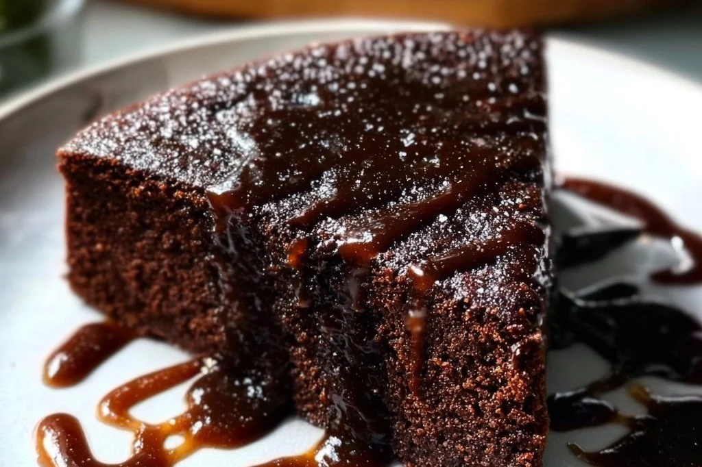 Delicious Dark Chocolate Whiskey Cake topped with chocolate ganache.